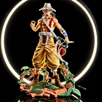 Figurine Usopp de One Piece avec fronde et socle végétal